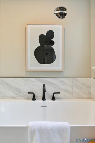 a bathroom with a shower and a glass door