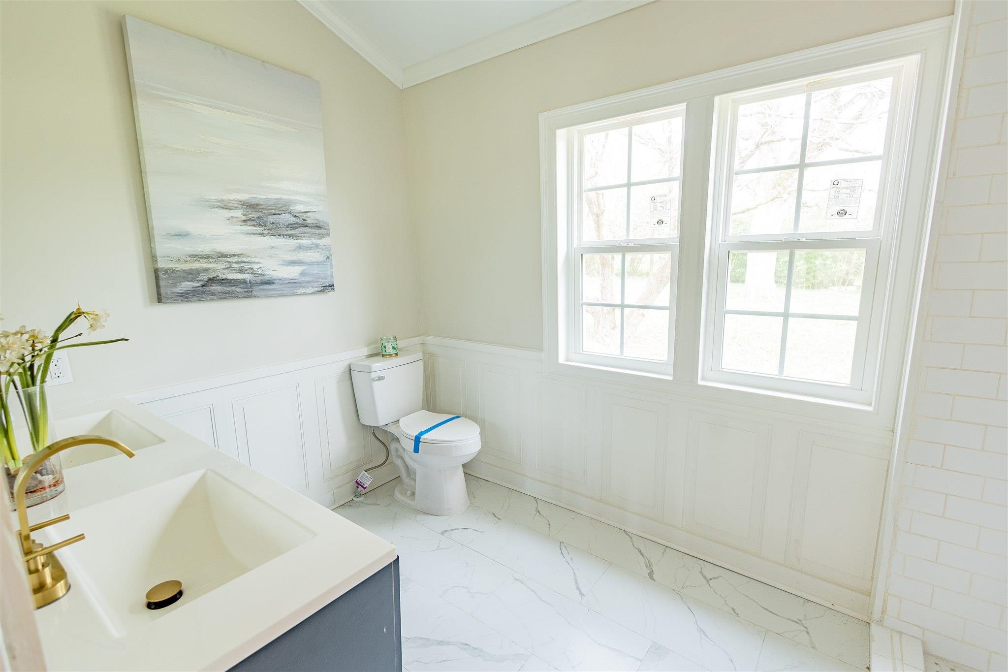 129 Warren Avenue Selmer, TN 38375 - Photo 25 of 28 a bathroom with a sink and a toilet