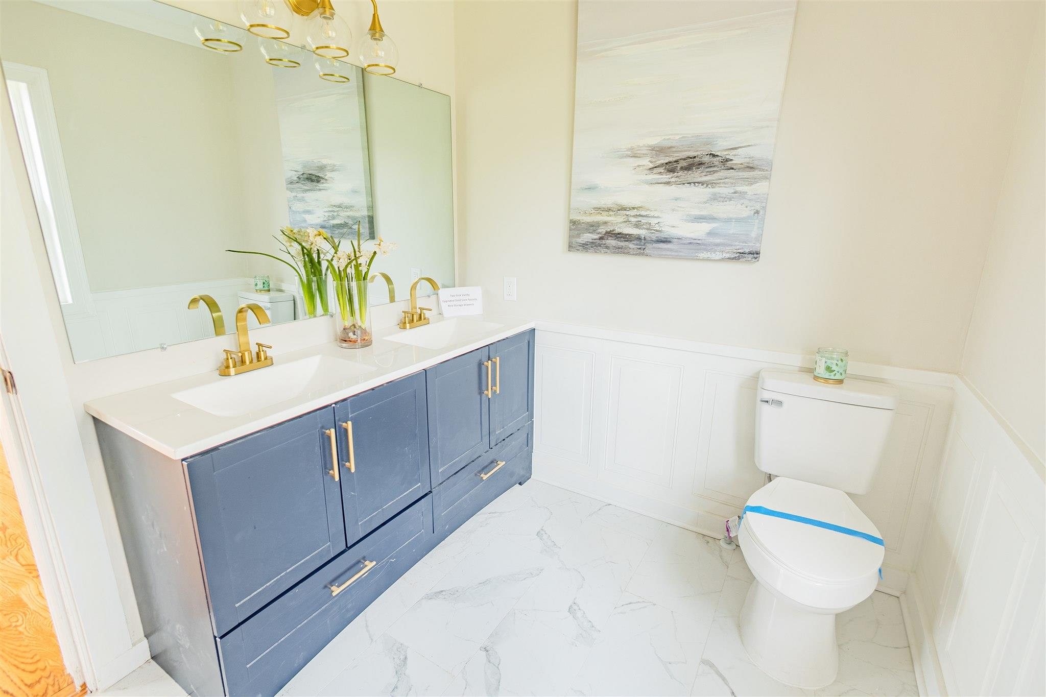 129 Warren Avenue Selmer, TN 38375 - Photo 26 of 28 a bathroom with a sink mirror and toilet