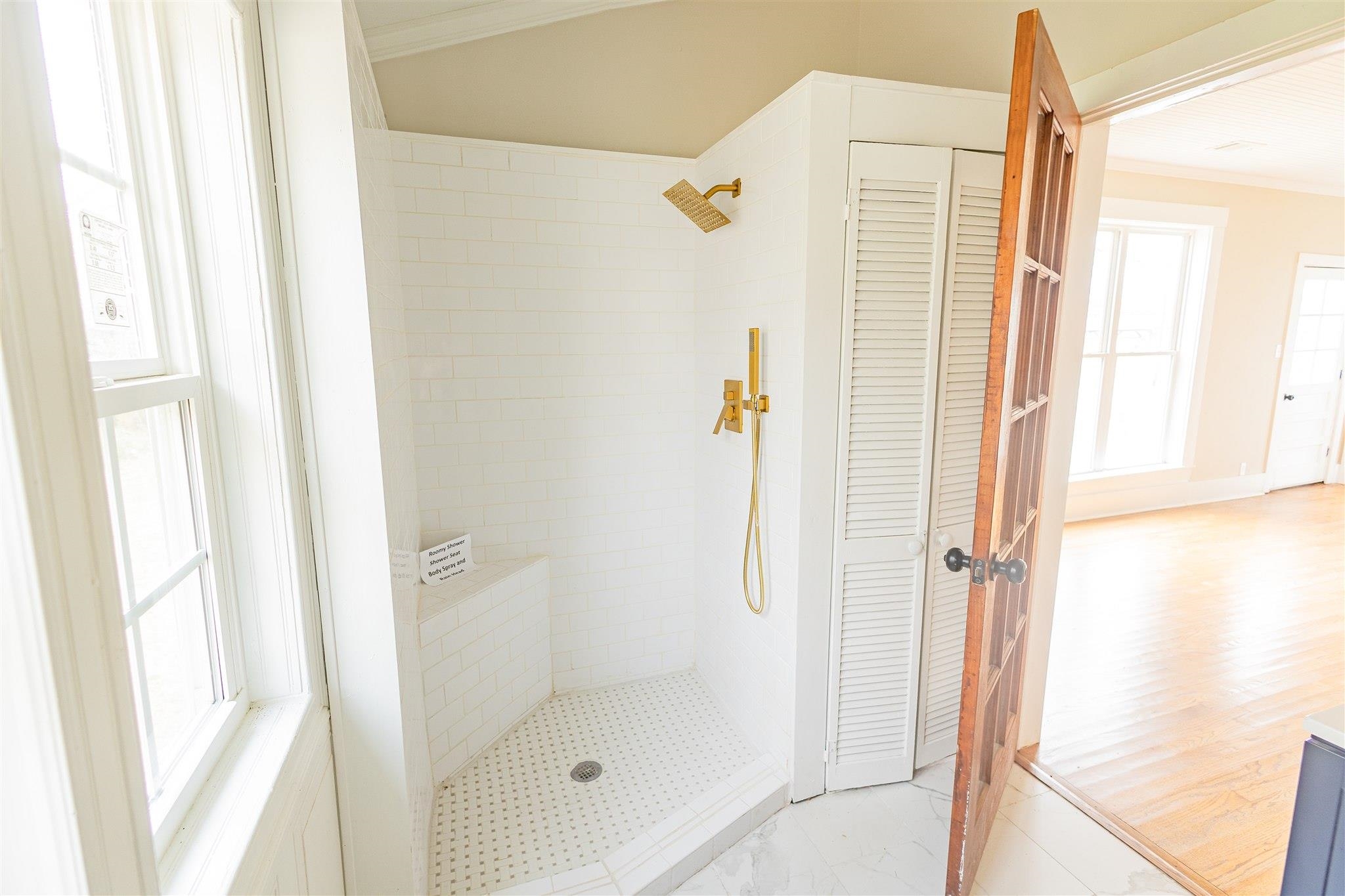 129 Warren Avenue Selmer, TN 38375 - Photo 27 of 28 a bathroom with a shower and a tub