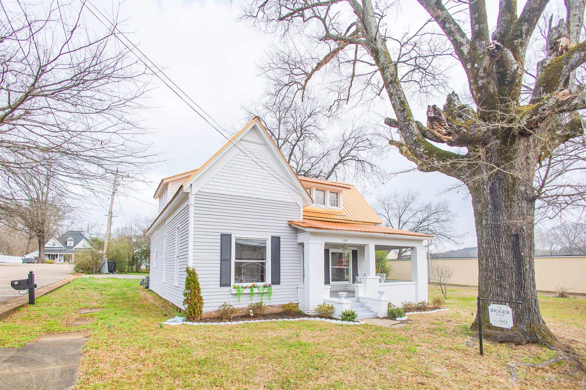 129 Warren Avenue Selmer, TN 38375 - Photo 3 of 28 a front view of house with yard covered in snow