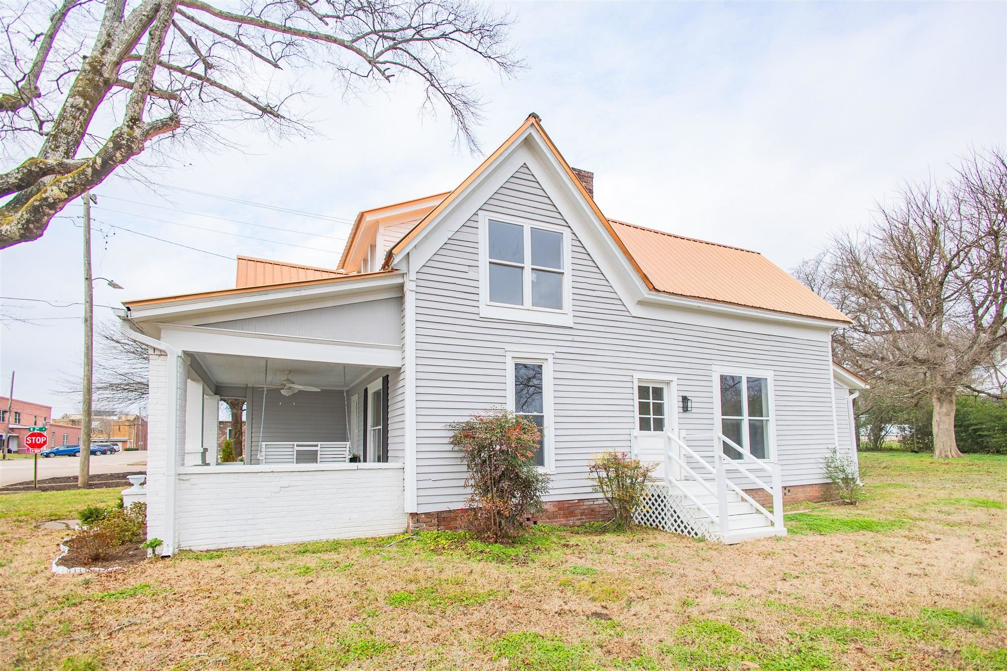 129 Warren Avenue Selmer, TN 38375 - Photo 5 of 28 a view of a house with a yard