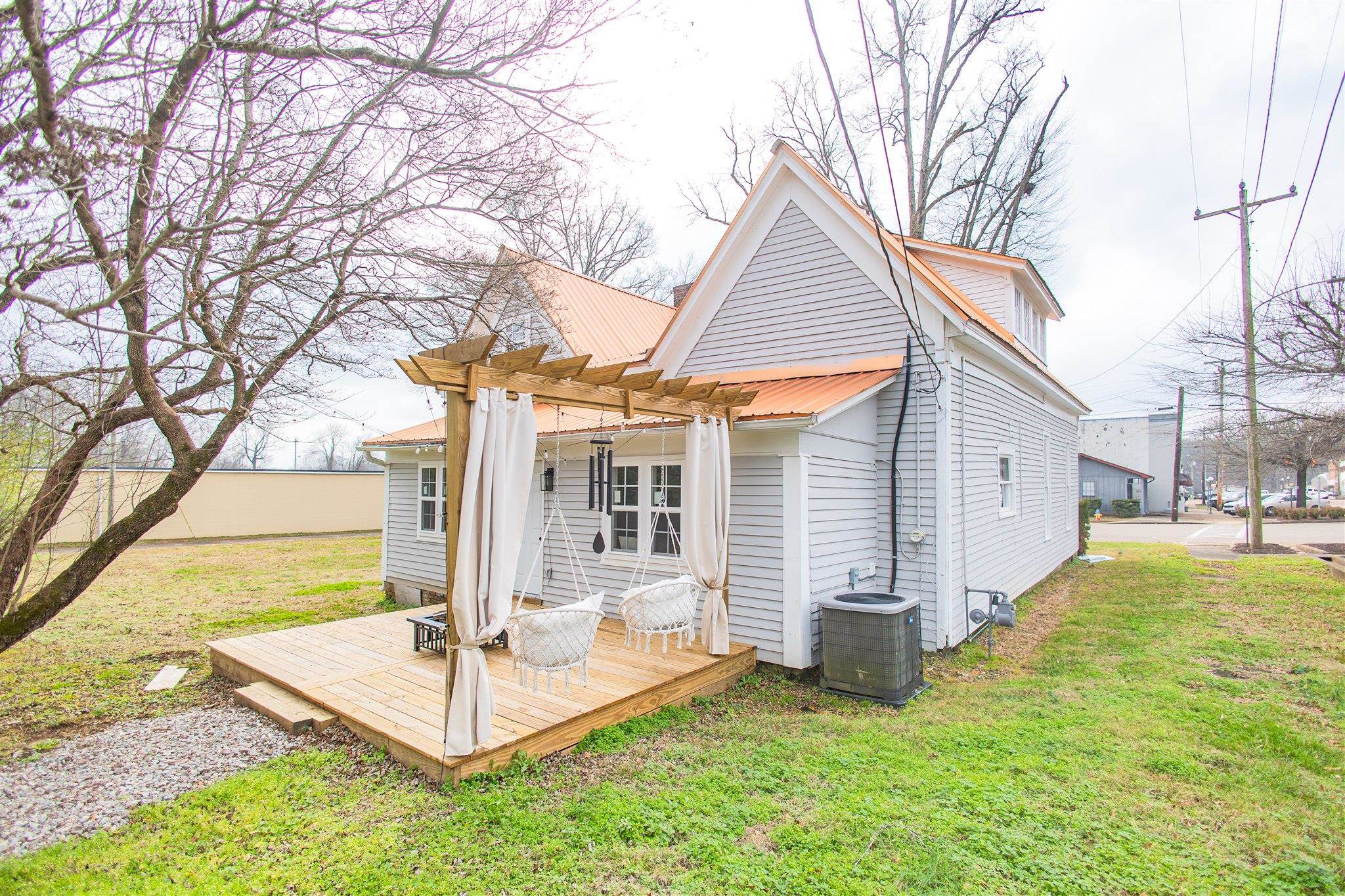 129 Warren Avenue Selmer, TN 38375 - Photo 7 of 28 a view of a house with a patio