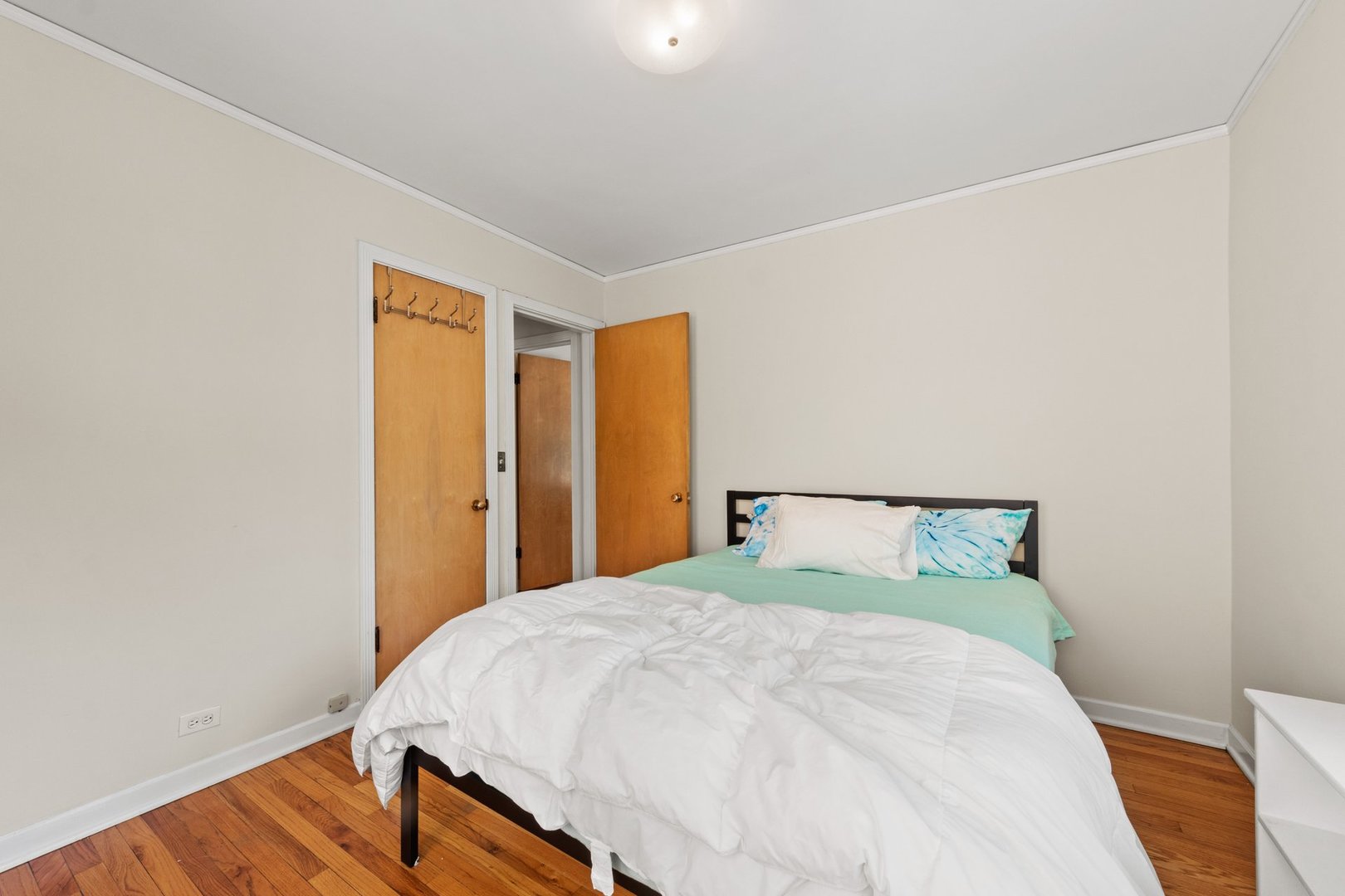 1408 Central Street, Unit 3N Evanston, IL 60201 - Photo 14 of 17 a bed sitting in a bedroom next to a window