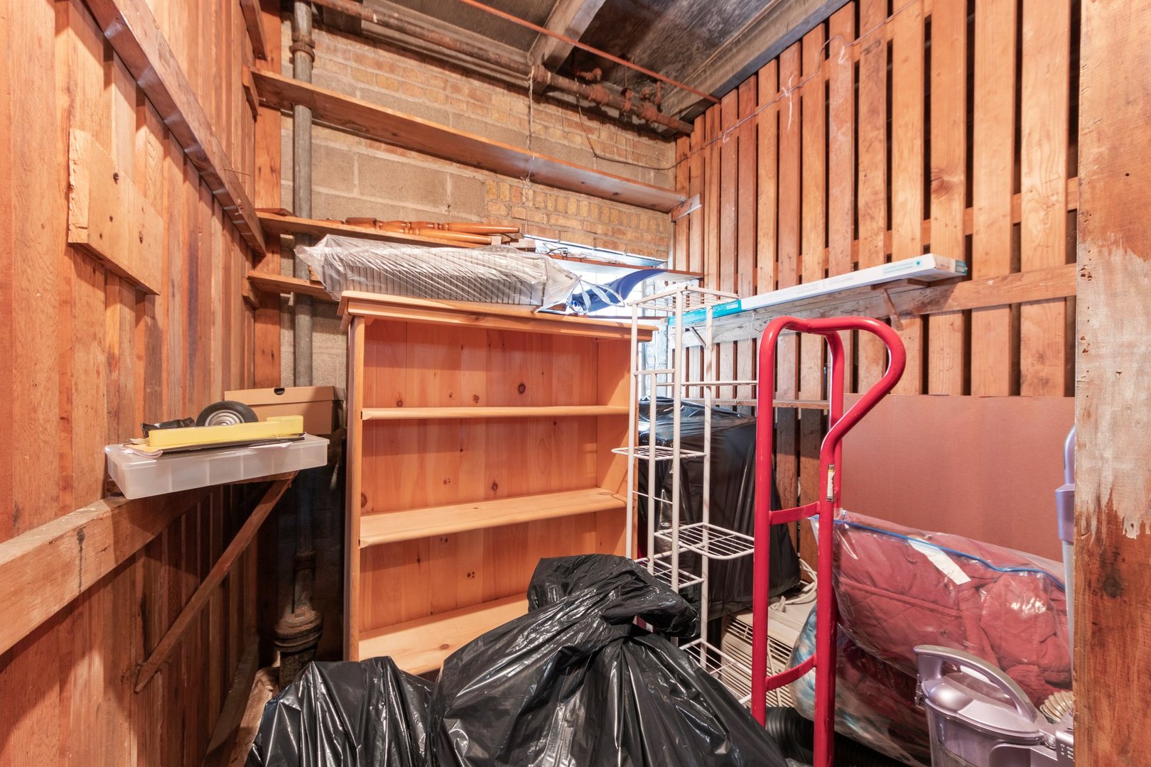 1408 Central Street, Unit 3N Evanston, IL 60201 - Photo 17 of 17 a view of walk in closet with clothes and shoes