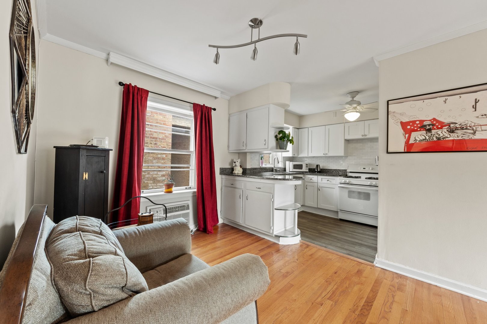 1408 Central Street, Unit 3N Evanston, IL 60201 - Photo 6 of 17 a living room with furniture and kitchen view