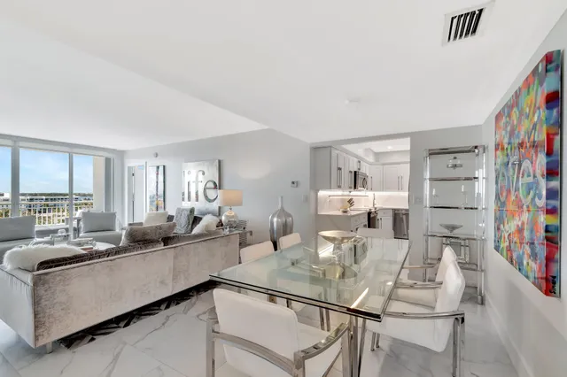 a living room with furniture and a book shelf