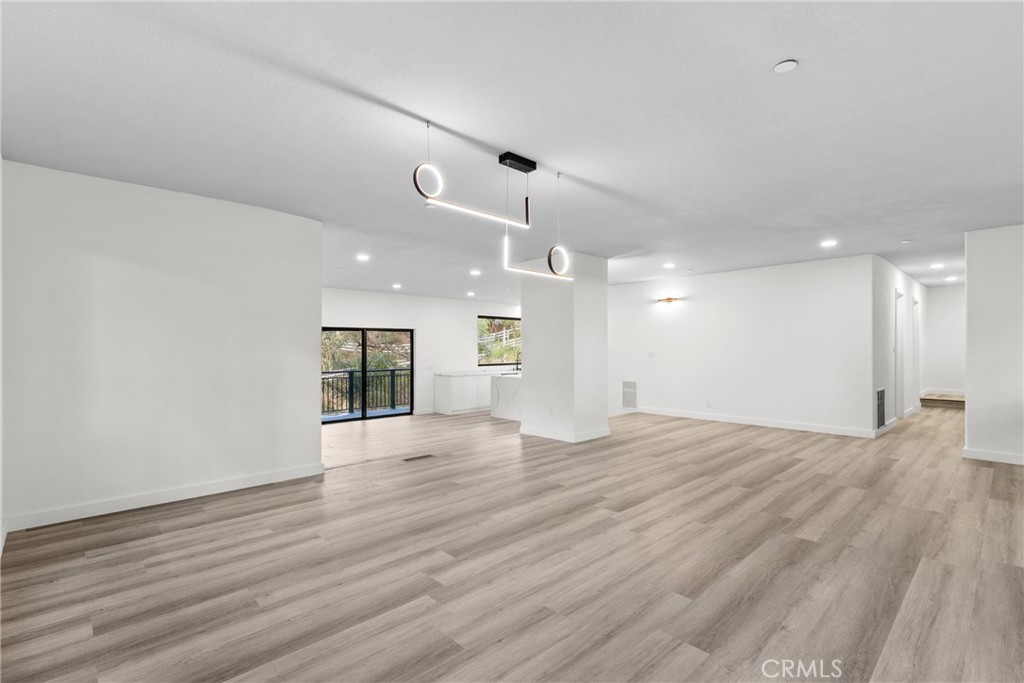 106 Buckskin Road Bell Canyon, CA 91307 - Photo 11 of 54 a view of an empty room with wooden floor and a window