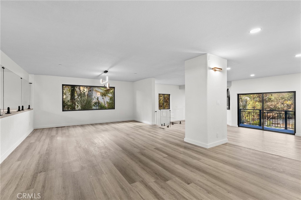 106 Buckskin Road Bell Canyon, CA 91307 - Photo 14 of 54 a view of an empty room with window and wooden floor