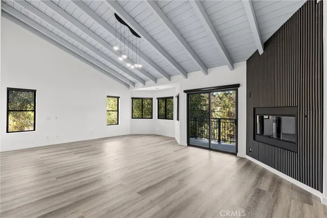a view of a livingroom with wooden floor