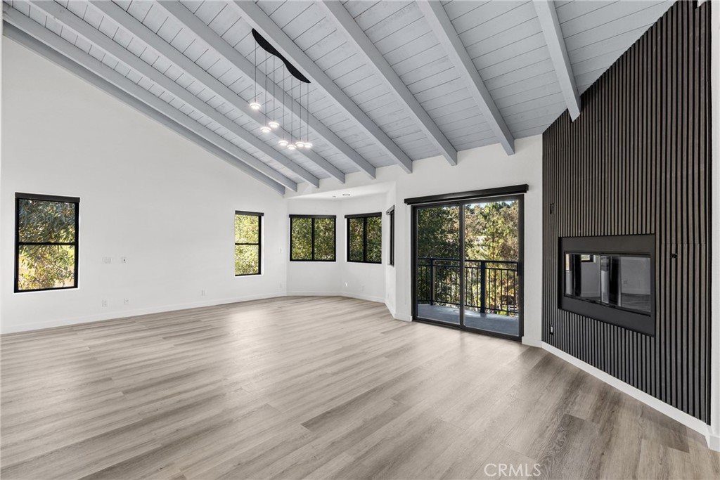 106 Buckskin Road Bell Canyon, CA 91307 - Photo 15 of 54 a view of an empty room with wooden floor and a window