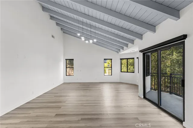 a view of a balcony with wooden floor