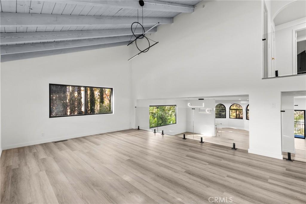 106 Buckskin Road Bell Canyon, CA 91307 - Photo 2 of 54 a view of an empty room with a window and wooden floor
