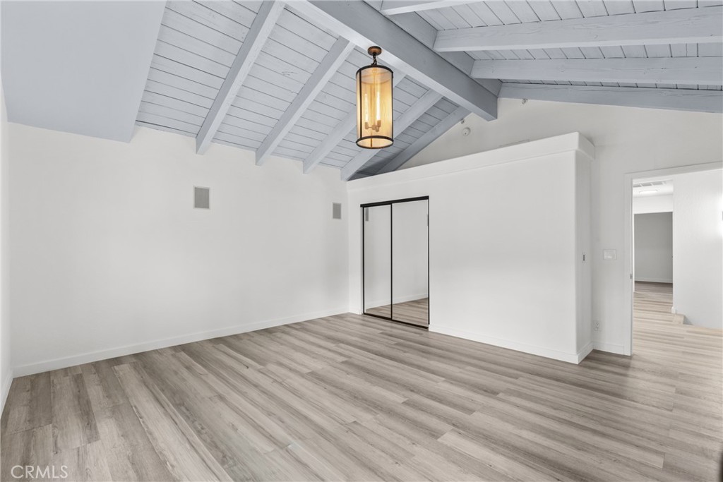 106 Buckskin Road Bell Canyon, CA 91307 - Photo 23 of 54 an empty room with wooden floor and windows