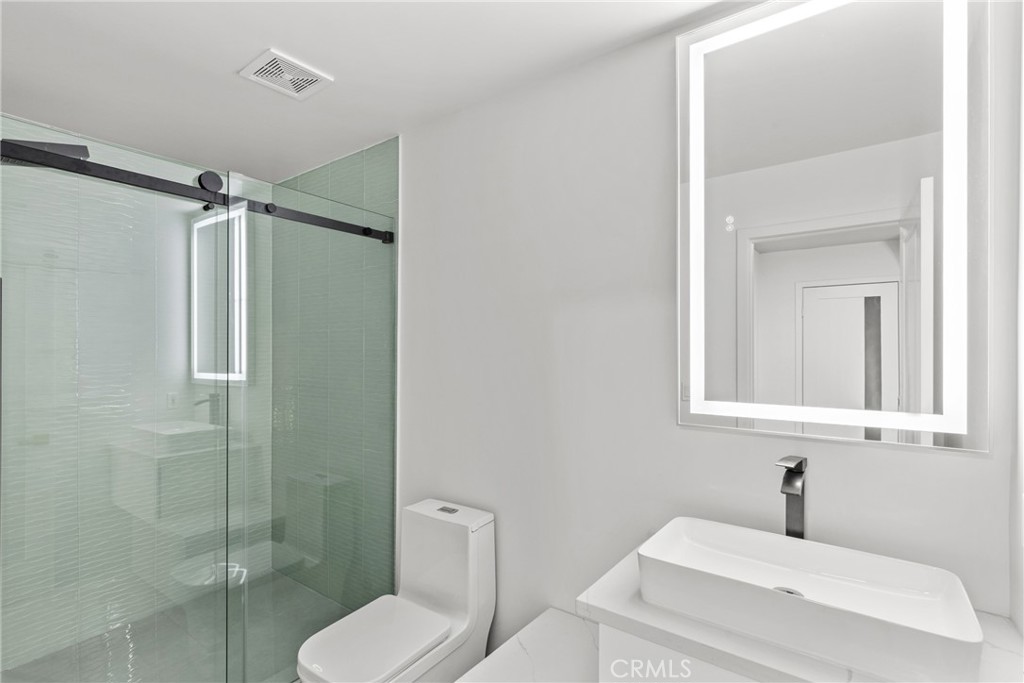 106 Buckskin Road Bell Canyon, CA 91307 - Photo 25 of 54 a bathroom with a toilet sink and shower