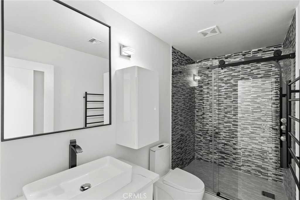 106 Buckskin Road Bell Canyon, CA 91307 - Photo 26 of 54 a bathroom with a shower toilet and sink