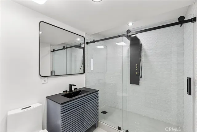 an empty room with wooden floor and window