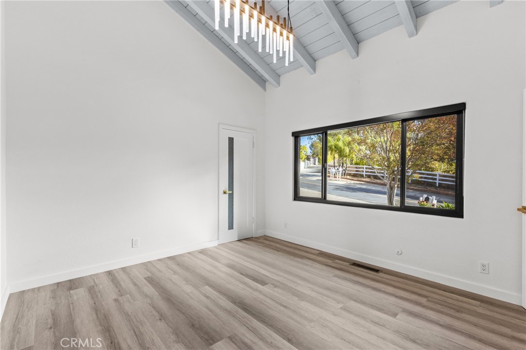 106 Buckskin Road Bell Canyon, CA 91307 - Photo 31 of 54 an empty room with wooden floor and windows