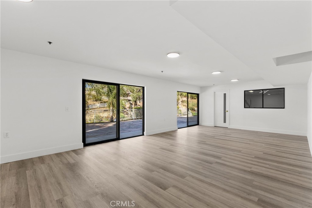 106 Buckskin Road Bell Canyon, CA 91307 - Photo 34 of 54 a view of an empty room with window and wooden floor
