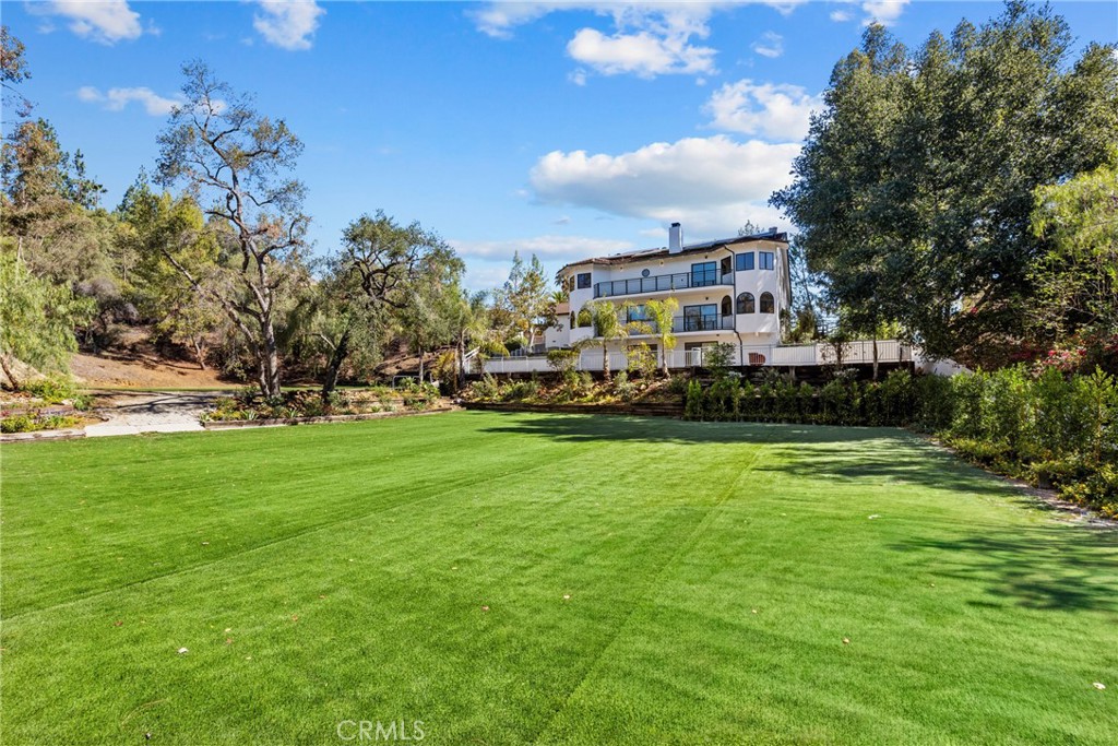 106 Buckskin Road Bell Canyon, CA 91307 - Photo 37 of 54 a view of a house with a big yard