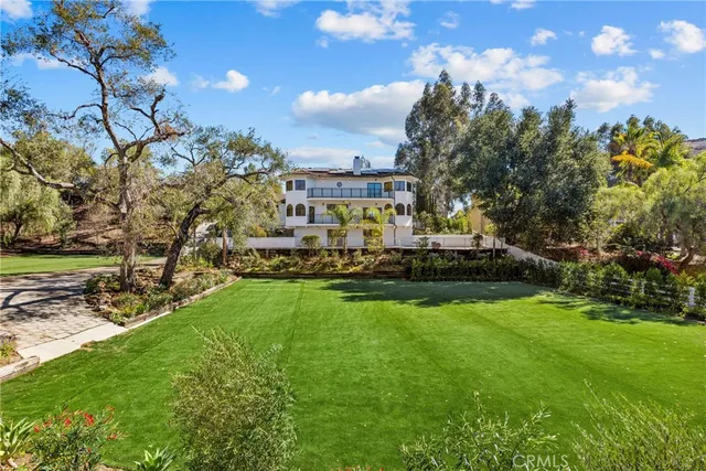 a aerial view of a house with a yard