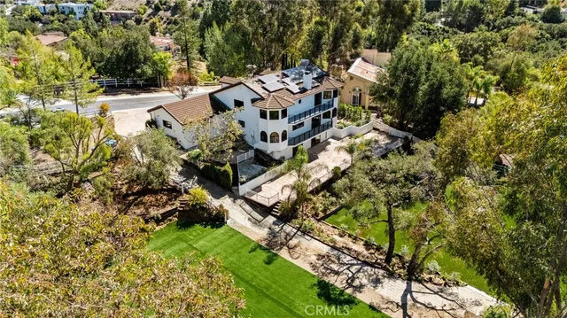 a view of a lake with a house in a yard