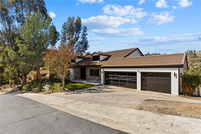 a view of a field of grass and trees