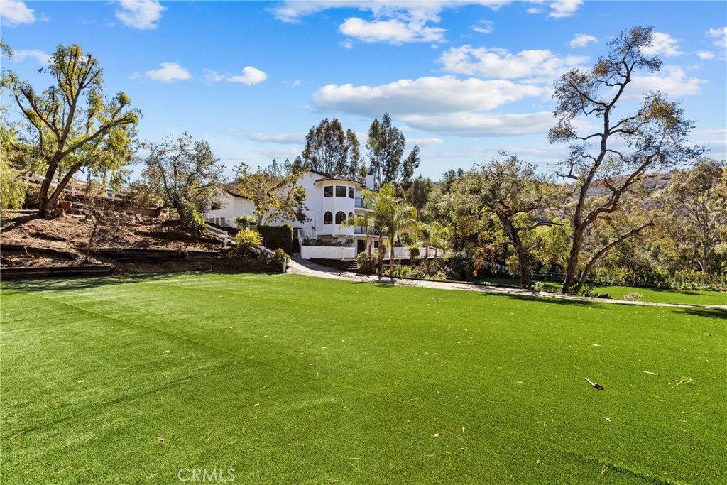 106 Buckskin Road Bell Canyon, CA 91307 - Photo 47 of 54 a view of a field of grass and trees