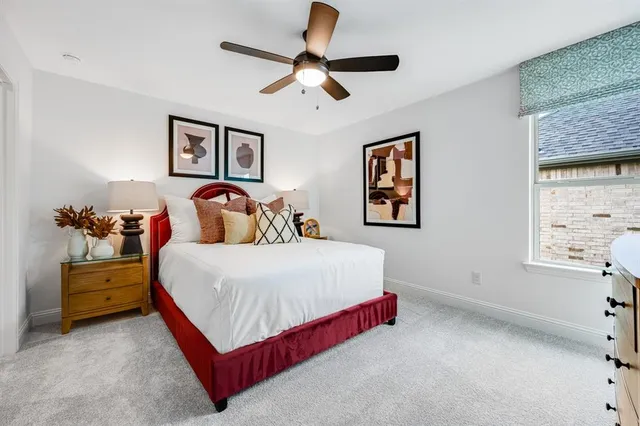 a bedroom with a bed and window