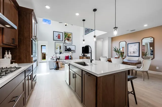 a living room with furniture and a ceiling fan