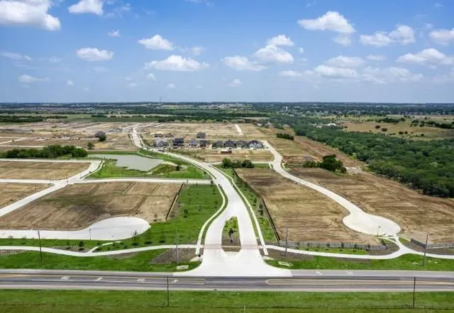an aerial view of a house with a lake view