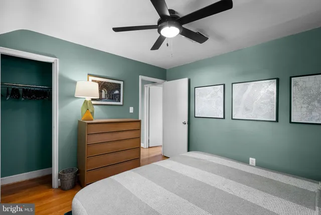 a bedroom with a bed and a dresser