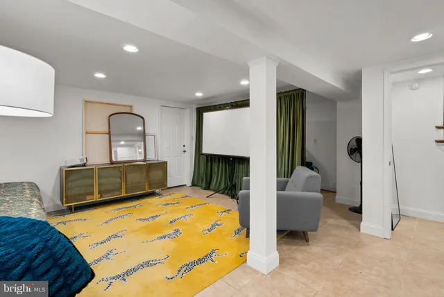 a bed room with furniture and a fireplace