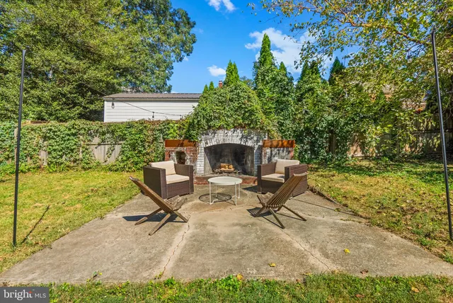 a view of a backyard with sitting area