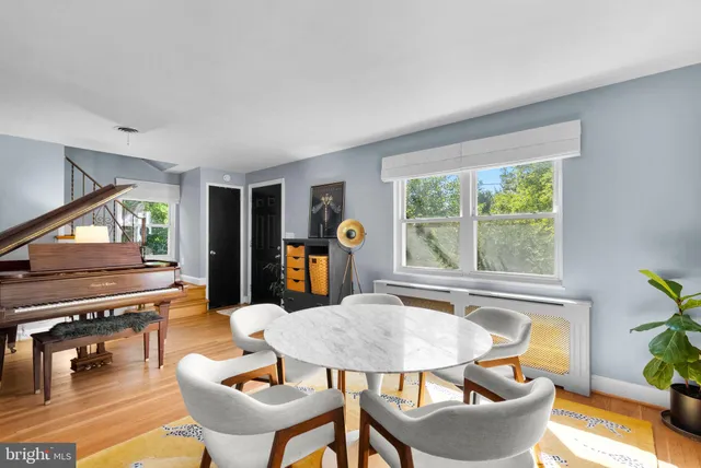 a dining room with furniture and window