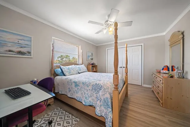 a bed room with bed and a window