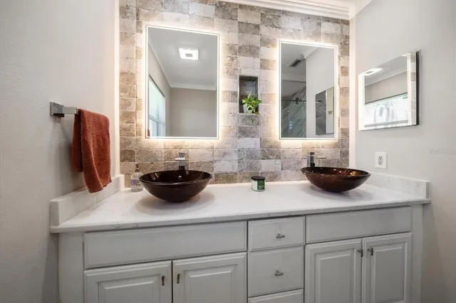 a bathroom with a granite countertop sink a toilet and bathtub