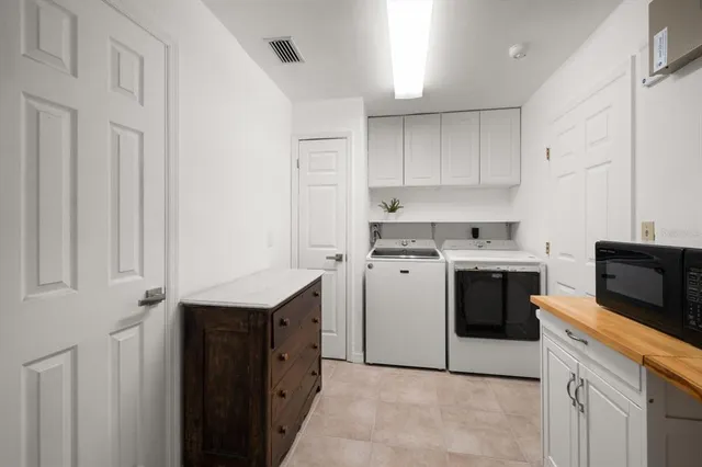 a view of a swimming pool with lounge chairs in patio