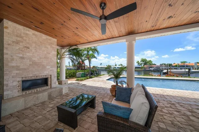 a view of a porch with chairs and backyard