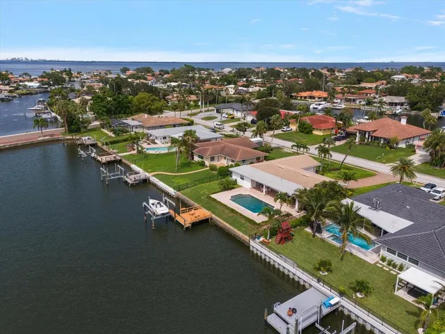 an aerial view of residential houses with ocean view