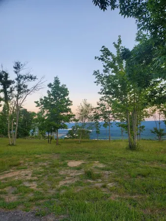 a view of a lake with a yard