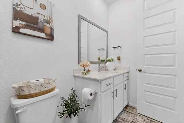 a bathroom with a sink a vanity and a mirror