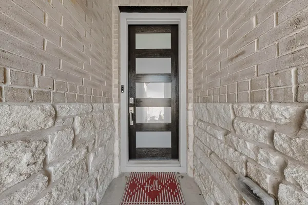 a bathroom with a shower and a mirror