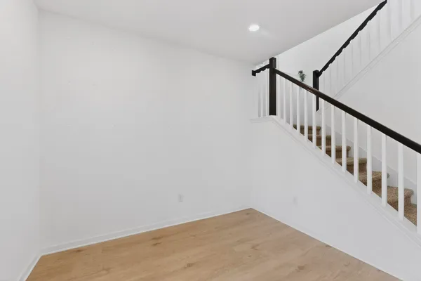 a view of an empty room with stairs