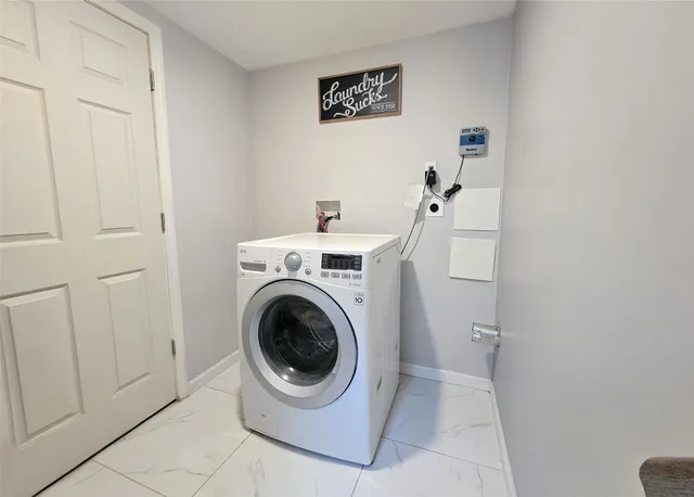 a utility room with dryer and washer