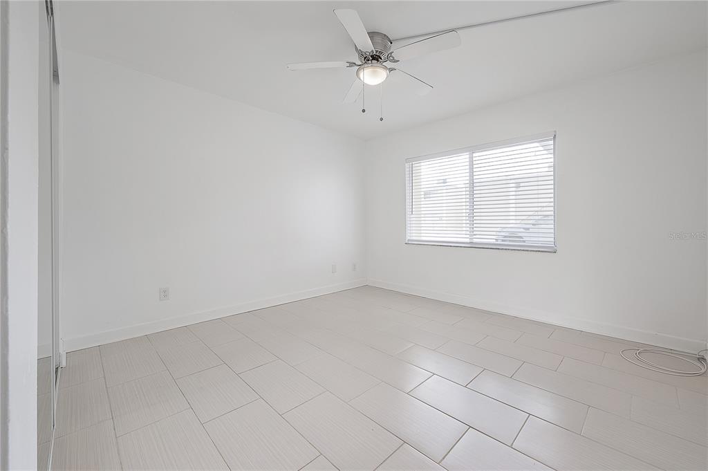 3206 West Azeele Street, Unit 129 Tampa, FL 33609 - Photo 15 of 30 an empty room with a window and a fan