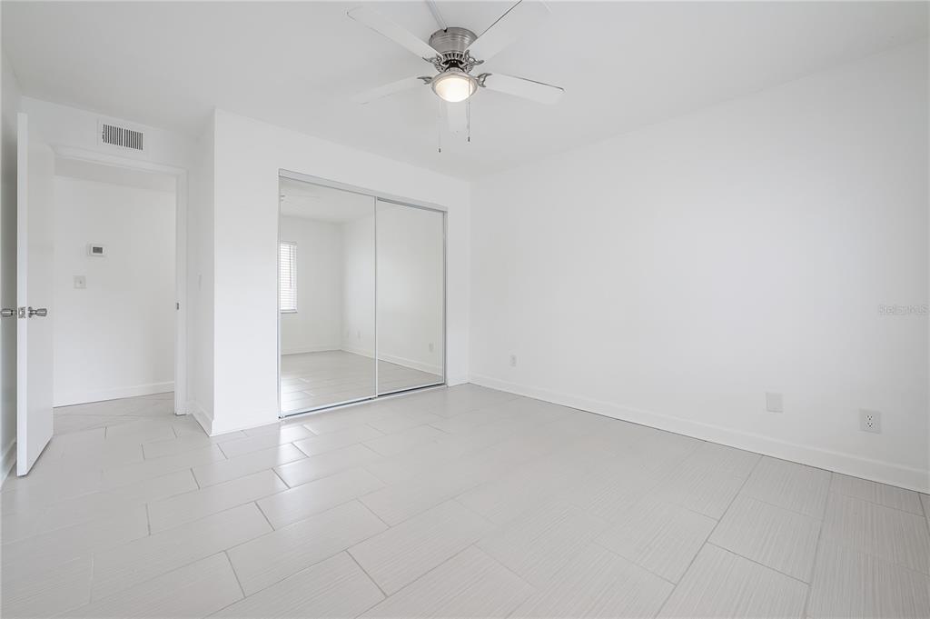 3206 West Azeele Street, Unit 129 Tampa, FL 33609 - Photo 16 of 30 wooden floor in an empty room
