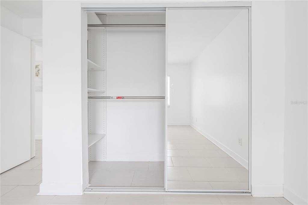 3206 West Azeele Street, Unit 129 Tampa, FL 33609 - Photo 17 of 30 a view of walk in closet with empty racks