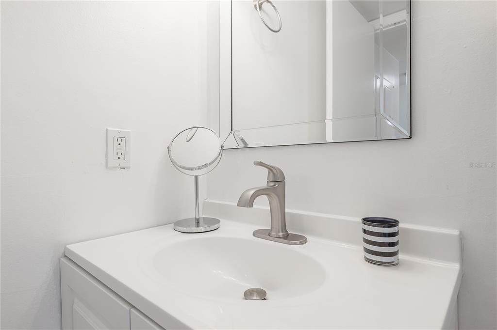 3206 West Azeele Street, Unit 129 Tampa, FL 33609 - Photo 20 of 30 a bathroom with a sink and a mirror