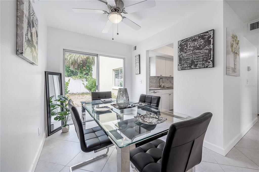 3206 West Azeele Street, Unit 129 Tampa, FL 33609 - Photo 8 of 30 a view of a dining room with furniture window and outside view